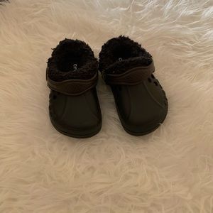Baby Crocs. Toddler size 6-7. Black. Never worn